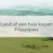 groen veld, huis in het midden de tekst: een huis of land kopen in de Filipijnen